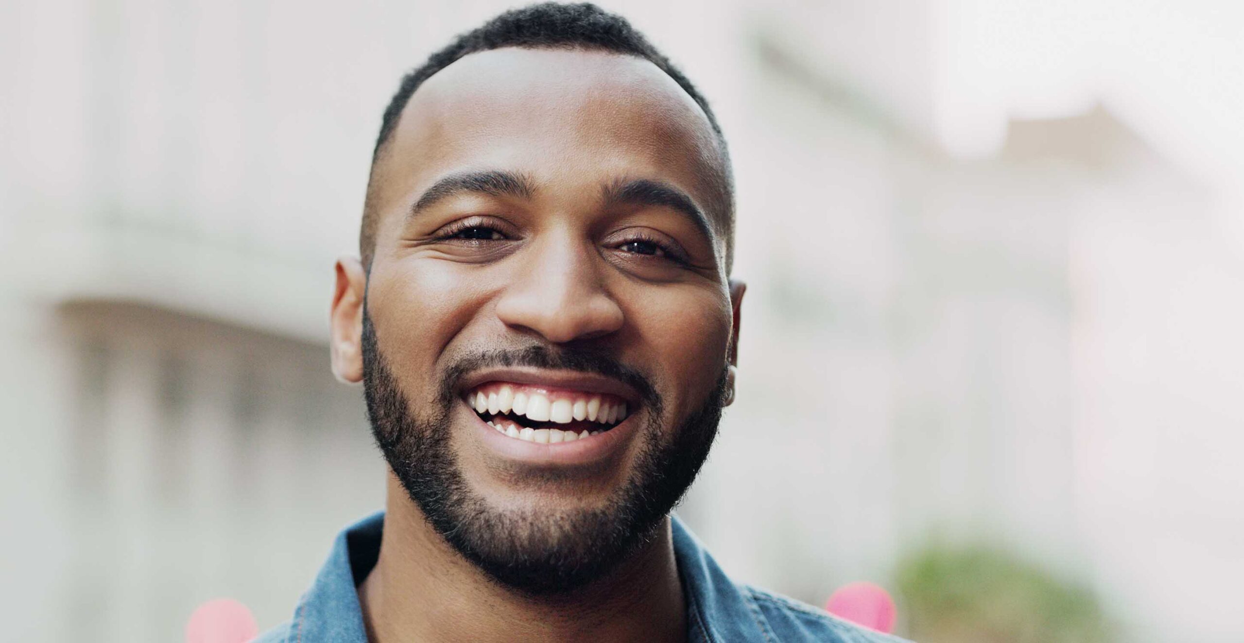 a man smiling after a consultation at beeston dental