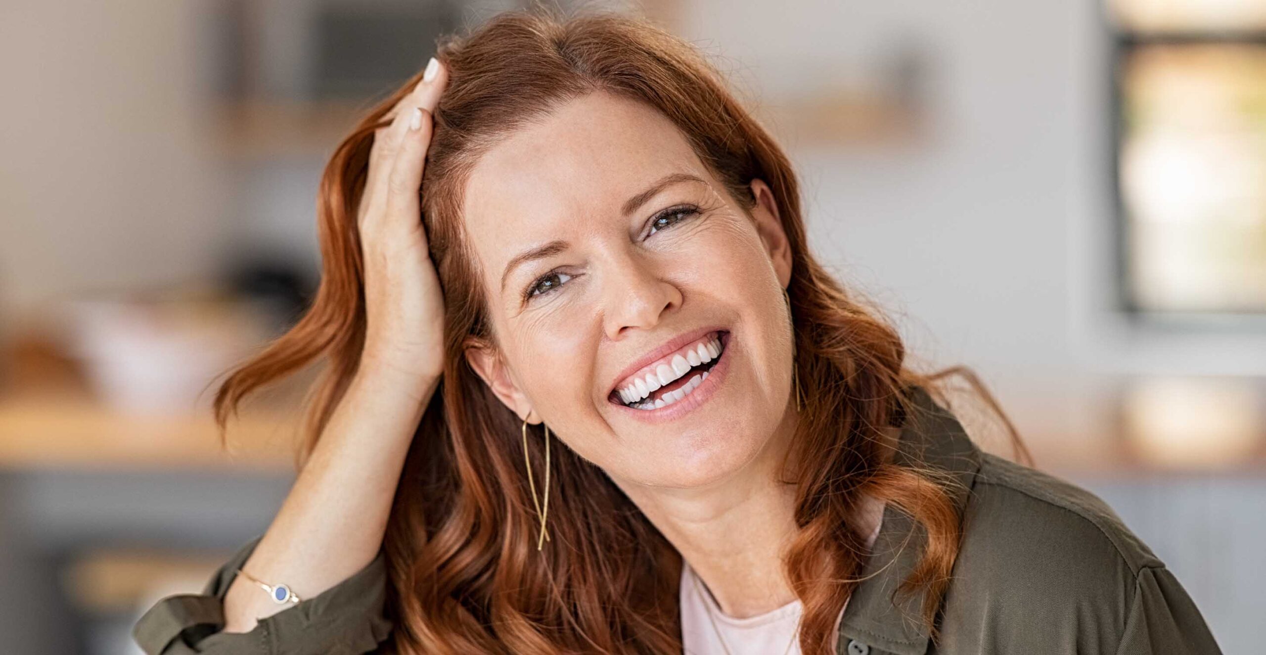 a woman smiling after a teeth straightening consultation
