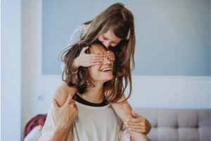 Woman and daughter laughing