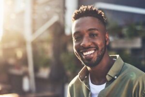 Man smiling - straight teeth after Invisalign treatment