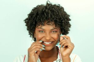 Woman with braces smiling at beeston dental centre